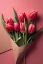 Bouquet of pink tulips in envelope on red background. Royalty Free Stock Photo