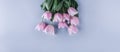 Bouquet of Pink tulips flowers over light blue background. Greeting card or wedding invitation Royalty Free Stock Photo