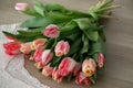 Bouquet of pink tulips on a light background. Holiday card. Royalty Free Stock Photo