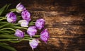 Bouquet of pink tulips on a wooden weathered vintage background. Spring flowers. Mother`s Day background Royalty Free Stock Photo