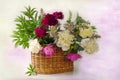 A bouquet of pink and white peonies in the basket . Still life with flowers Royalty Free Stock Photo