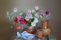 Bouquet of poppies, daisies and ceramics on the table. Still life with wild flowers Royalty Free Stock Photo