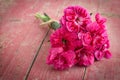 Bouquet of purple carnations on pink wooden background Royalty Free Stock Photo