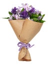 Bouquet of purple flowers in a craft paper wrapping cornet tied with canvas ribbon bow isolated Royalty Free Stock Photo