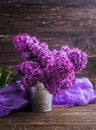 Lilac flowers in decorative tin bucket