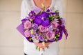 Bouquet with purple orchids, roses, Hydrangea flower in hands Royalty Free Stock Photo