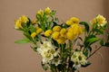 Bouquet of random flowers in a vase. Bouquet of yellow lilies, c