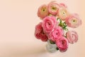 Bouquet of ranunculus in glass vase closeup. Ranunculus asiaticus or Buttercup persian. Ranunculus of peach gelado blossom. Nice