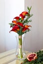 Bouquet of red calla lilies in a glass vase