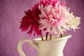Bouquet of red, pink and white flowers in a white metal vase Royalty Free Stock Photo