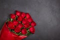 Bouquet of red roses.  Beautiful flowers on a black background. Top view, flatlay, copy space Royalty Free Stock Photo