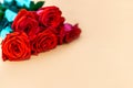 A bouquet of red roses on begie background Royalty Free Stock Photo