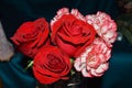 Bouquet of red roses and  bicolored carnations Royalty Free Stock Photo