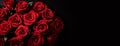 Bouquet of red roses on a black background, top view with copy space Royalty Free Stock Photo