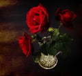 Bouquet of red roses in a crystal vase. Old paper texture Royalty Free Stock Photo