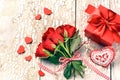 Bouquet of red roses with decorative heart and present. St Valen Royalty Free Stock Photo