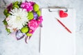 blank paper clipboard,pen, daisy and roses bouquet. Elegant, Beauty blog composition.Valentine's Day,Mother's Royalty Free Stock Photo