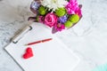 blank paper clipboard,pen, daisy and roses bouquet. Elegant, Beauty blog composition.Valentine's Day,Mother's Royalty Free Stock Photo