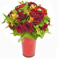 Bouquet of red roses and gerberas in vase isolated on white Royalty Free Stock Photo