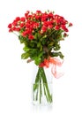 Bouquet of red roses in glass vase over white Royalty Free Stock Photo