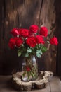 bouquet of red roses in glass vase on wooden background Royalty Free Stock Photo