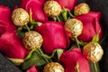 Bouquet of red roses with golden chocolate