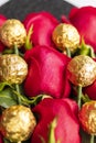 Bouquet of red roses with golden chocolate