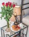 Bouquet of red roses with nice breakfast