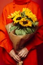 Bouquet of of yellow sunflowers over a red background Royalty Free Stock Photo