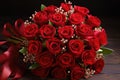 Bouquet of Red Roses on Wooden Table Royalty Free Stock Photo