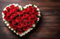 Bouquet of red roses in the shape of a heart on a wooden table. Valentine\'s Day, Mother\'s Day. Copy space Royalty Free Stock Photo
