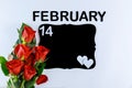 Bouquet of red roses with text february 14 and mockup black board isolated on white background