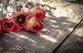 A bouquet of red tulips and white flowers on a background of wooden, old boards. Place for text. The concept of spring has come Royalty Free Stock Photo