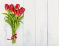 Bouquet of Red tulips on white wooden background Royalty Free Stock Photo