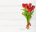 Bouquet of Red tulips on white wooden background Royalty Free Stock Photo