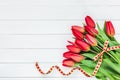 Bouquet of red tulips on white wooden background Royalty Free Stock Photo