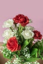 bouquet of red, white and pink roses on pink background. Closeup Royalty Free Stock Photo