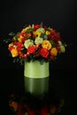 Bouquet with red and yellow roses on table Royalty Free Stock Photo