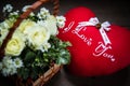 bouquet rose flower in a basket and pillow heart Royalty Free Stock Photo