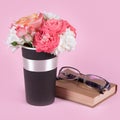 Bouquet of rose flowers, book and glasses on pink background. Royalty Free Stock Photo