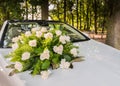 Bouquet of roses on the bride car Royalty Free Stock Photo