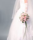 Bouquet of roses in bride's hands. Royalty Free Stock Photo