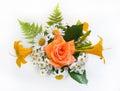 Bouquet of roses, chamomiles and daylilies. Flowers in a bouquet of country style on a white background. Royalty Free Stock Photo