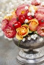 Bouquet of roses and chrysanthemums in vintage silver vase Royalty Free Stock Photo