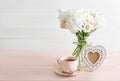 Bouquet of roses, eustomas and hydrangeas on table. Cup of tea and photo frame. Greeting card for mothers day. Cozy good morning. Royalty Free Stock Photo