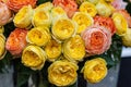 A bouquet of roses of exotic multi colors. Chameleon flowers with colored petals at the edges. Flower market. Royalty Free Stock Photo