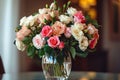 Bouquet of roses, flowers in a glass vase on a dark smudged background. Flowering flowers, a symbol of spring, new life Royalty Free Stock Photo