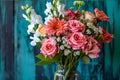 Bouquet of roses, flowers in a glass vase on a wooden background. Flowering flowers, a symbol of spring, new life Royalty Free Stock Photo