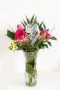 Bouquet with roses in a glass vase on a white background Royalty Free Stock Photo