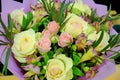 Bouquet of roses and lilies close-up. Beautiful flowers with green leaves. Yellow and pink roses, Burgundy lilies Royalty Free Stock Photo